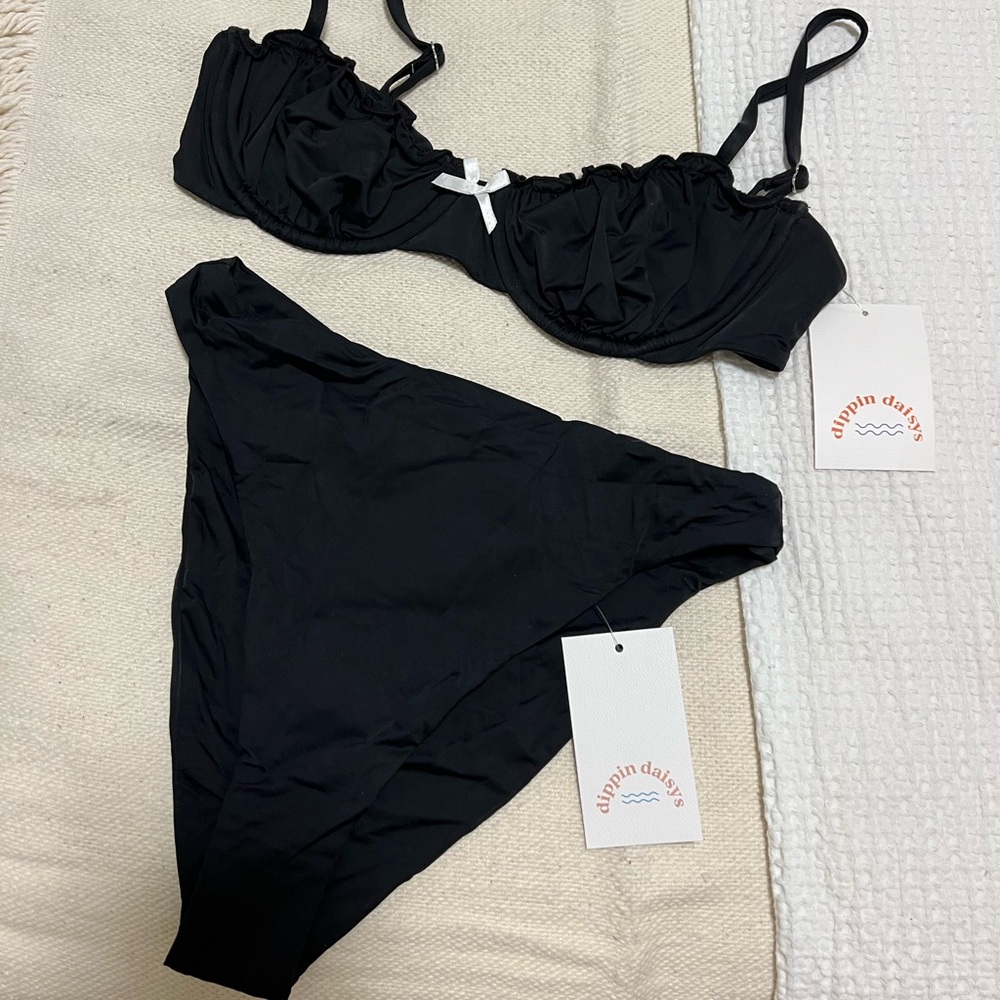 Selling this Dippin Daisys bikini top and bottom (both a size medium)